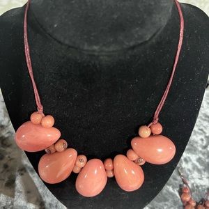 Tagua nut necklace Approx 18” in length. In a beautiful light pink color.